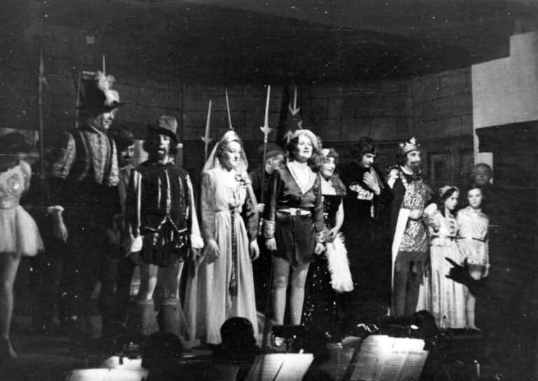 Babes in the Wood 1955: the principal cast in a line on stage, including the King, the Principal Boy, Maid Marian and the two Babes